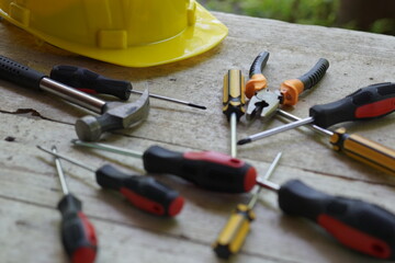 Set of professional construction tools and safety helmet on work table. Top view. Old tools. Various tools on a wooden table