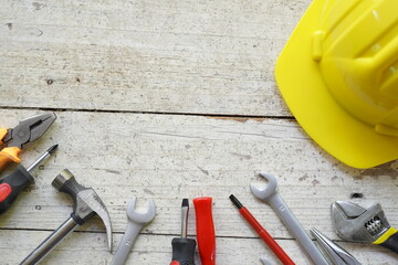 Set of professional construction tools and safety helmet on work table. Top view. Old tools....