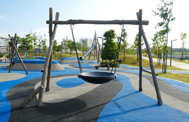 Selective focus picture of flying saucer swing at the park during daytime