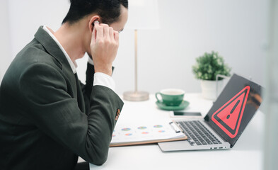 developer using computer laptop with triangle caution warning sign for notification error and maintenance concept. Computer virus detected, network security and maintenance concept.
