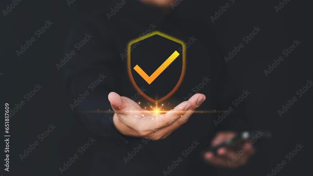 Fototapete User hand show on warranty identity proof icon for security protection system on virtual screen. Quality assurance of business service. Certified guarantee approval or secure access system concept.
