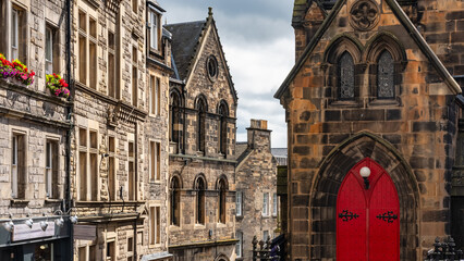 Old stone buildings and medieval appearance in the downtown monumental city of Edinburgh, Scotland.