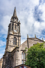 Fototapeta na wymiar High towers of monumental buildings in the medieval city of Edinburgh, Scotland.