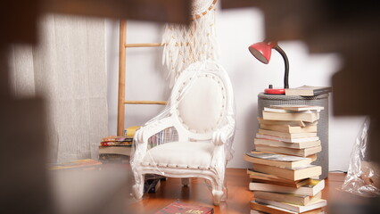 white chair light books ladder in frame