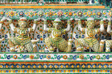 Fototapeta na wymiar Yaksha and monkey supporting figures decorating prang, Wat Arun