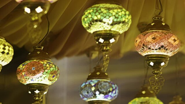 Traditional handmade multicolor Turkish, Moroccan, Arabian lamps hanging for Ramadan Kareem greeting.