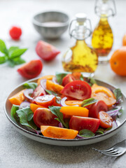 Green salad from leaves and tomatoes
