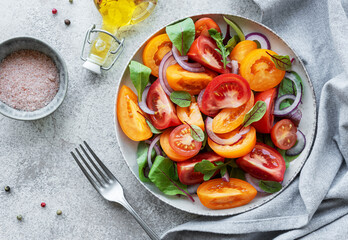 Green salad from leaves and tomatoes