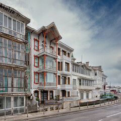 White wooden traditional residential buildings in Arnavutkoy neighborhood, Besiktas district, Istanbul, Turkiye, in a sunny spring day