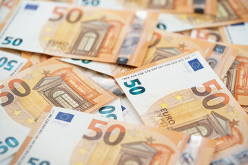 many 50 euro bills close-up mixed haphazardly