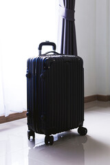 black travel bag,Luggage or suitcases in modern hotel during check-in It's time to travel, service, travel, summer vacation and vacation concept
