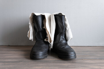 Boots and footcloths are a military and tourist form of clothing. - obrazy, fototapety, plakaty