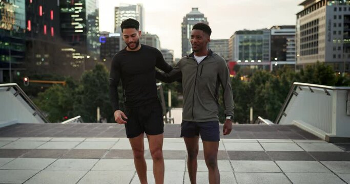 Fitness friends, men high five and running in city for cardio, support and success during workout. People training for race, health and sports, urban and runner team outdoor together with trust