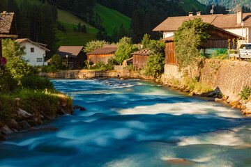 Fototapeta na wymiar Alpine summer view with silky water effect at St Johann, San Giovanni, Ahrntal valley, Pustertal, Trentino, Bozen, South Tyrol