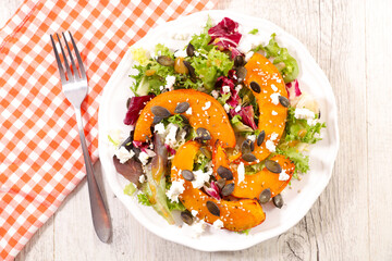 vegetable salad with slices of pumpkin