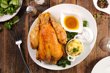 roasted chicken with sauce on table