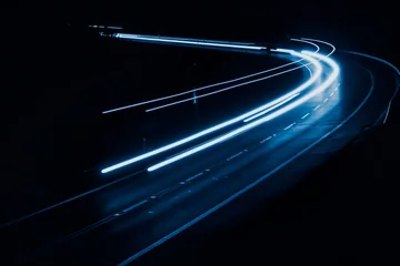 Zelfklevend Fotobehang blue car lights at night. long exposure © Krzysztof Bubel