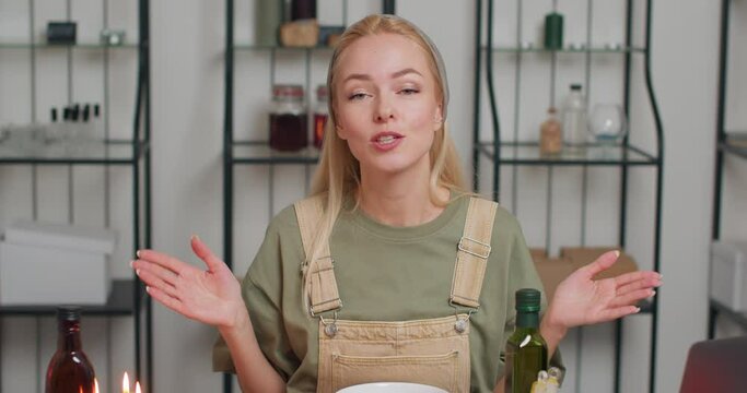Beautiful woman perfumer displaying natural perfume Beauty aromatherapy and natural care product advertising.