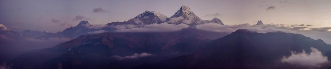 Fotobehang Dhaulagiri Panoramic view of the Himalayan mountain range with the world's highest peaks covered in snow at sunset
