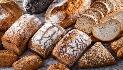 Assorted bakery products including loaves of bread and rolls