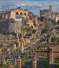 Ruins on the Roman Forum with temples, basilicas and Colosseum in the background, Rome, Italy