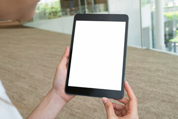 Hand holding digital tablet with blank screen for graphic display montage.