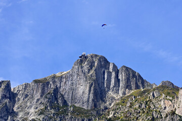 Paraglider flying over Le Brevent, Chamonix-Mont-Blanc, France