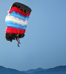 parachutist on blue sky skydiving extreme sport