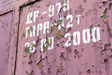 Close up shot of an old paint on the metal surface. Background