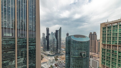 Panorama showing Dubai international financial center skyscrapers with promenade on a gate avenue...