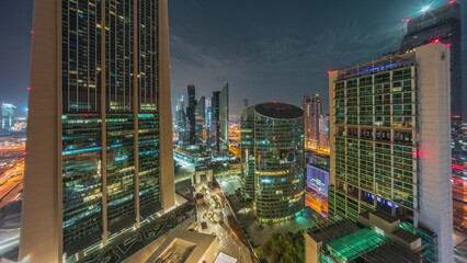 Dubai international financial center skyscrapers aerial all night.