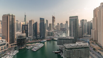 Panorama showing overview to JBR and Dubai Marina skyline with modern high rise skyscrapers waterfront living apartments aerial