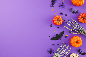 Infusing your home with the spooky charm of Halloween. Top view flat lay of scary skeleton arms,...