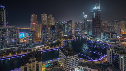 Fototapeta na wymiar Panorama showing Dubai Marina skyscrapers and JBR district with luxury buildings and resorts aerial night