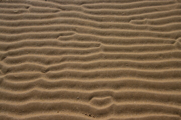 Natural sand pattern at a beach for background