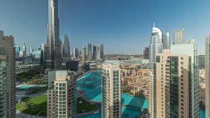 Panorama showing Dubai Downtown cityscape with tallest skyscrapers around aerial.