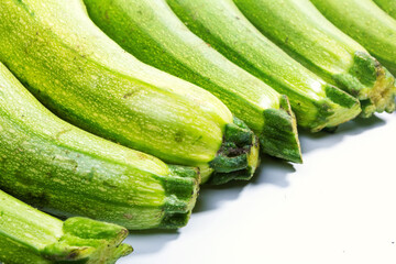 a lot of zucchini on a white background