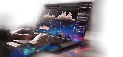 Businessman hand working on computer monitor with glowing forex chart. Investment and trading concept. Trading market banner
