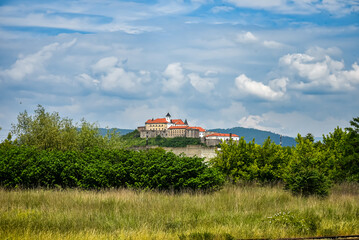 View of Palanok Castle or Mukachevo Castle and fields