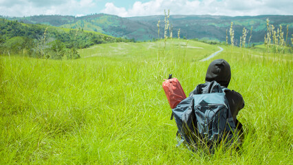 person on a meadow, sulawesi, indonesia