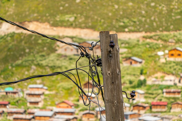 Electricity poles and cables used in mountain villages