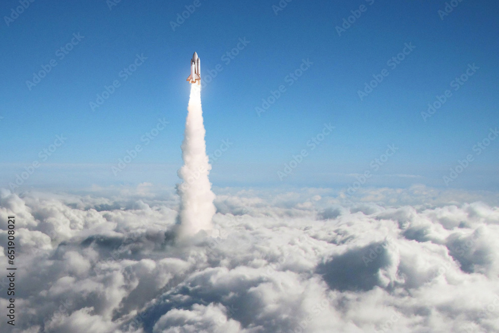Aufkleber space shuttle rocket lift off through the clouds into sky. spaceship launch above the clouds. space 