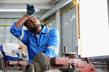 workers or technicians feeling tired from hot weather over heat in the factory