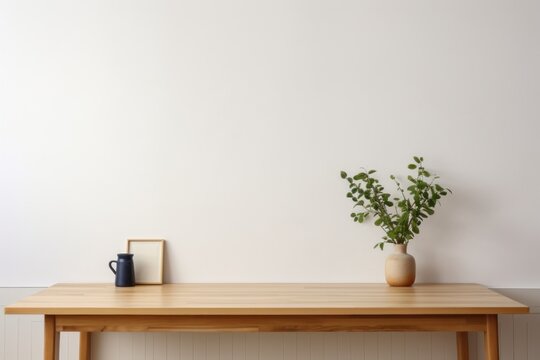 Simple workplace, wooden table with picture frame, coffee cup and houseplant. Generated by AI