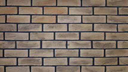 graphic resource of beige brickwork with dark seams, light texture background of aged bricks with a relief surface, design space of a fragment of a brick wall with empty spaces for inserting text