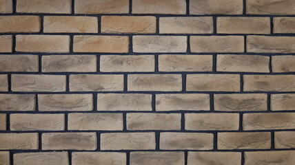 Obraz premium graphic resource of beige brickwork with dark seams, light texture background of aged bricks with a relief surface, design space of a fragment of a brick wall with empty spaces for inserting text