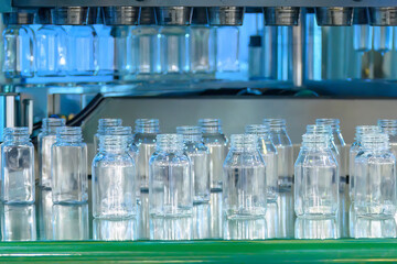 The plastic bottle manufacturing process by vertical blow mold machine.