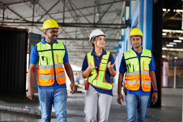 factory workers walking and talking about work or project in the warehouse storage