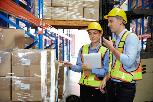 factory workers working and checking corrugated box in the warehouse storage