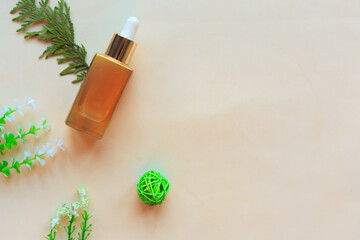 Cosmetic bottle and herbs on white background. Flat lay, top view. Natural cosmetic product concept